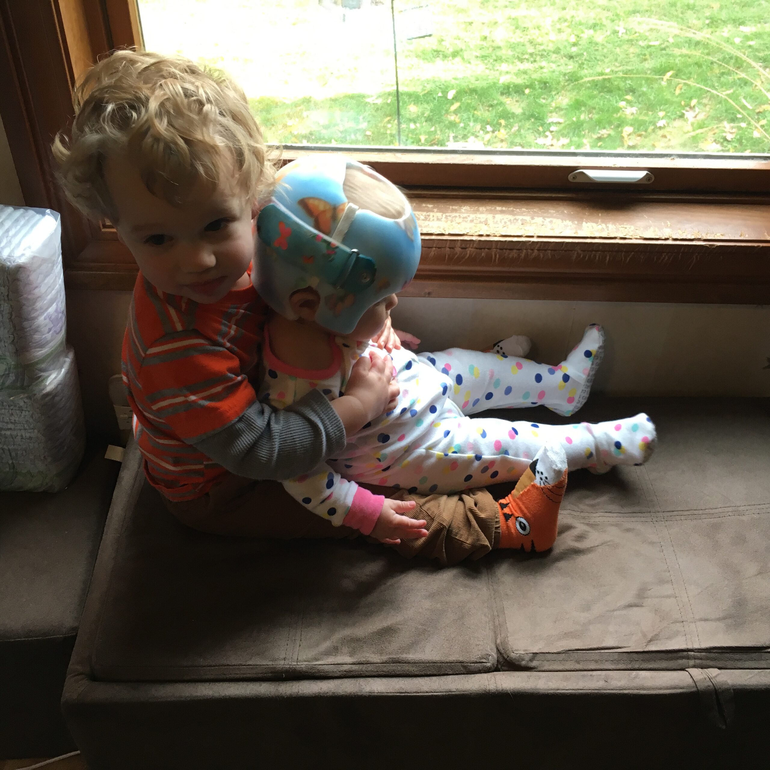 IMG_3479 Theo holding Anneliese in their window seat