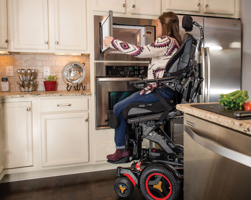 active-reach-microwave Woman reaching into her microwave using the Active Reach feature