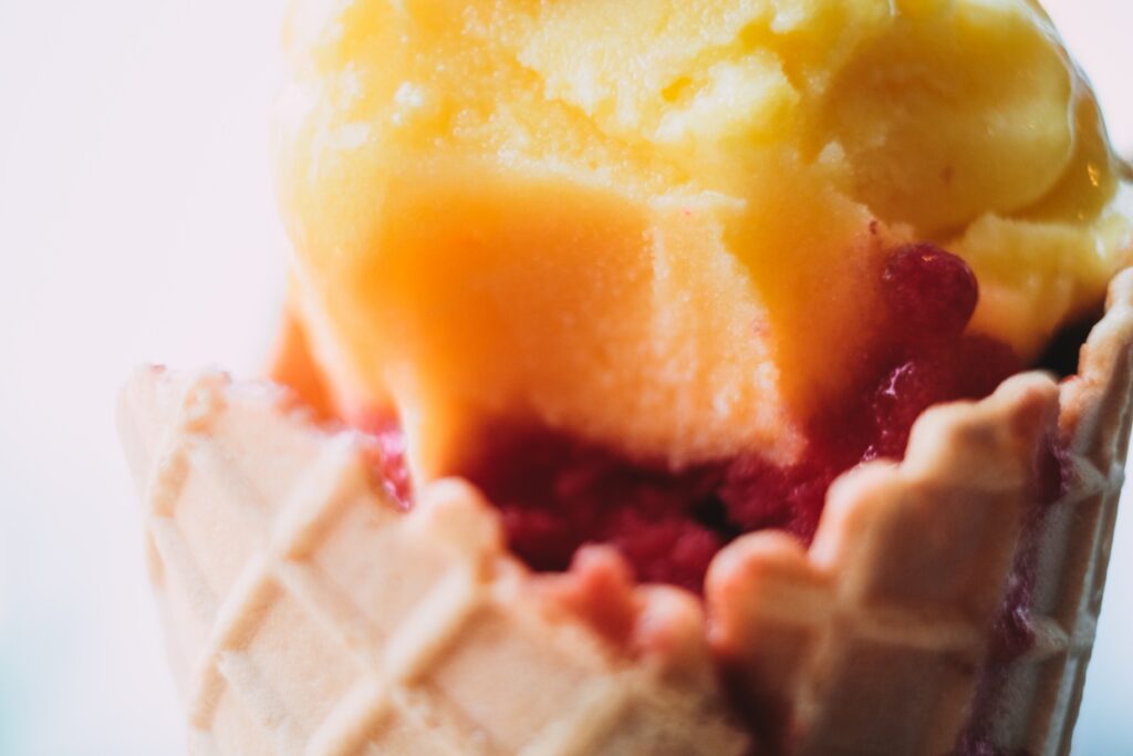 Up close picture of a waffle cone holding ice cream.
