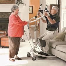 Get u Up A man and assistant using a sit to stand device