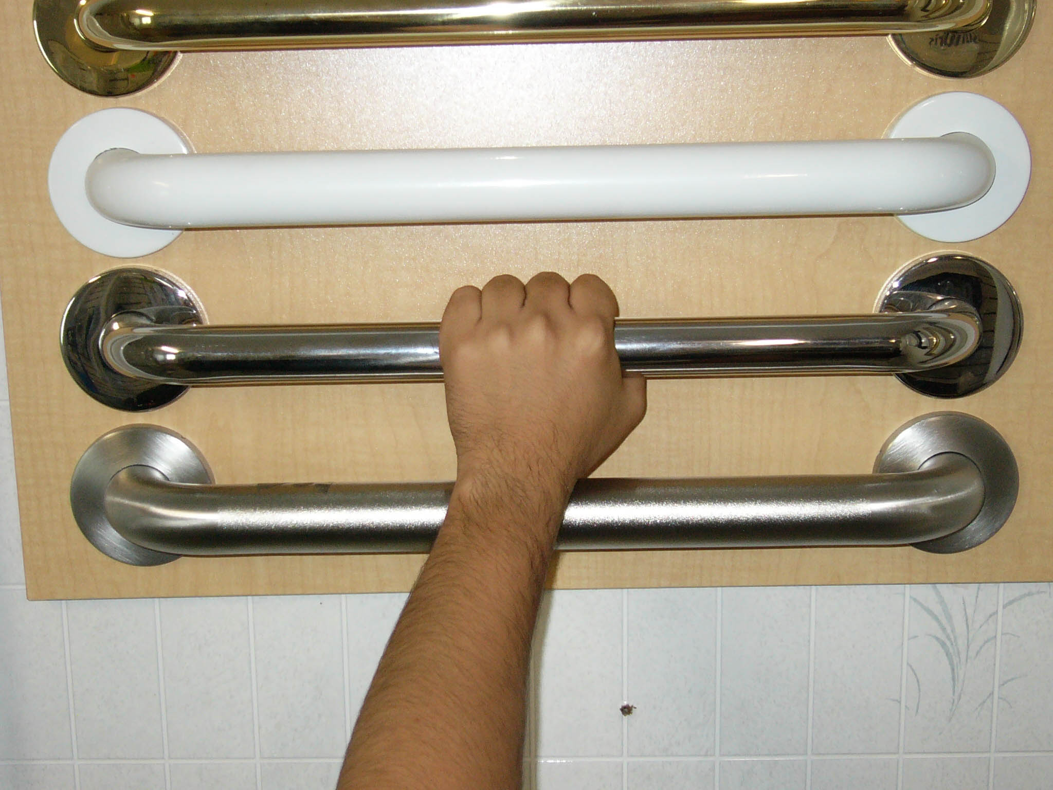 grab bars 4 different color grab bars with arm and hand grasping one