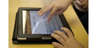 iPads-and-apps-200x100 Person's hands on an iPad