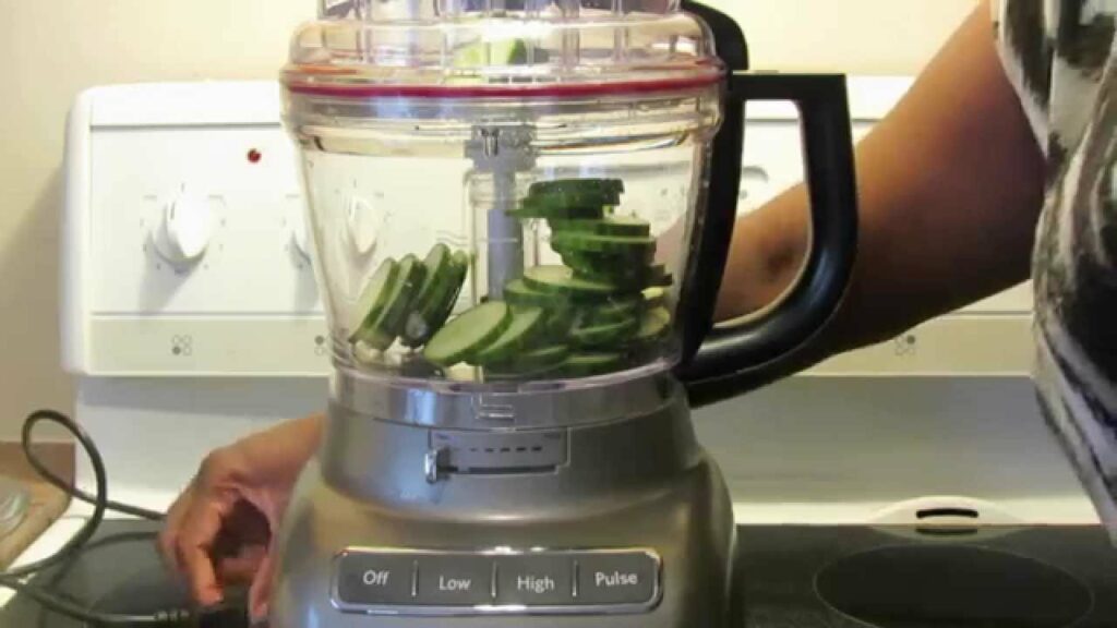 Food processor containing cucumber slices