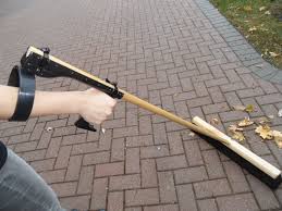 Robo Handle Device that attaches to the handle of lawn tools, allowing you to put your arm through a ring and to a grip that lower down on the handle