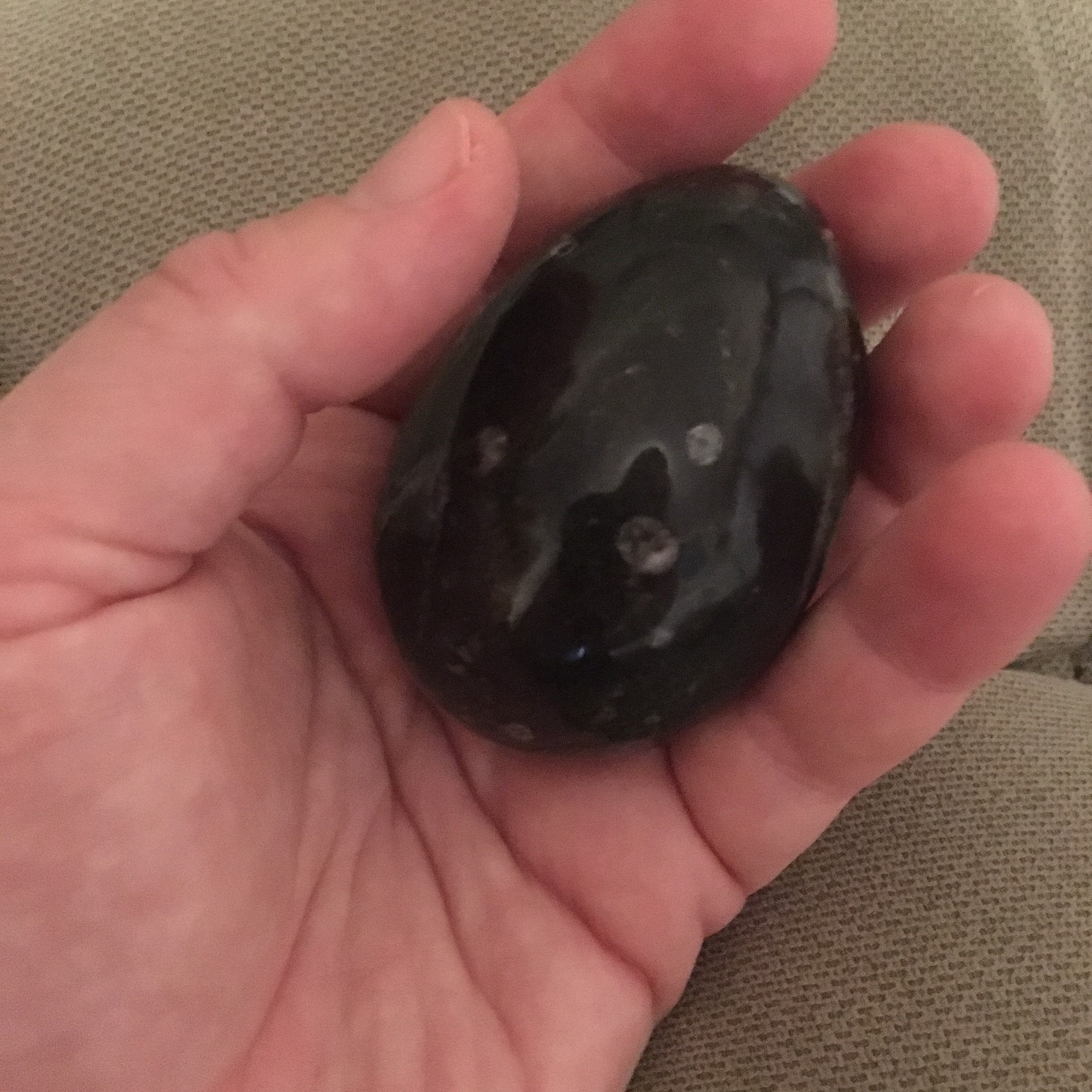Rock This snowflake obsidian rock fits well in my hand and offers enough weight and size to register strongly with my brain as I pass it back and forth between my hands.