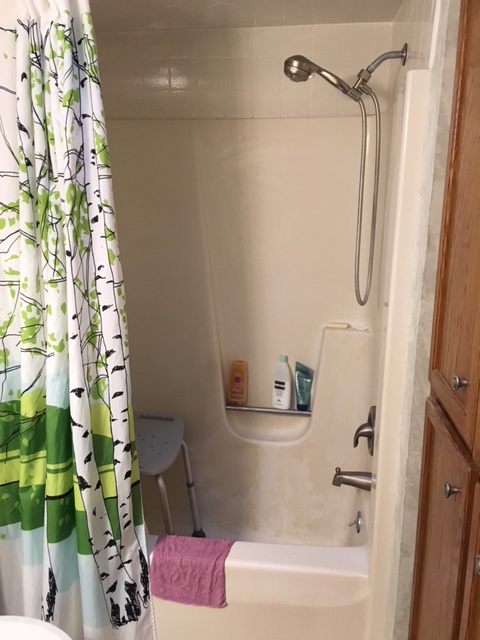 my new tub set up with my shower bench installed and my handy handheld showerhead