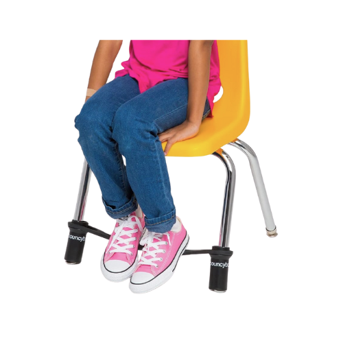 bbands child sitting in yellow chair on feet of chair there is a band going from one of the front legs to the other with the childs feet resting on top of it