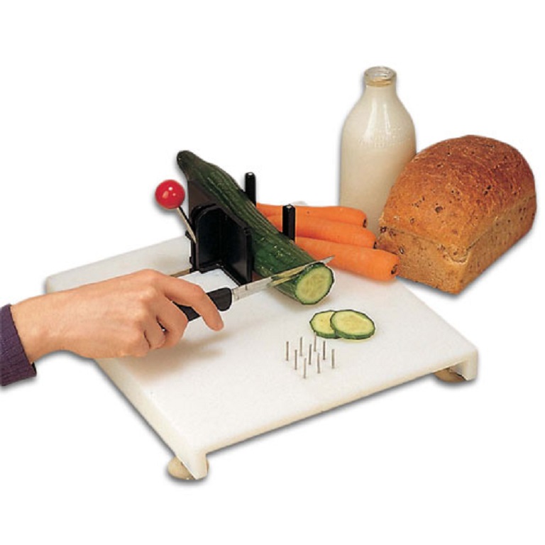 cutting-board-4 image of one handed cutting board with a varitiy of ways to hold items to make it easier to cut with one hand